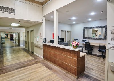 The nurse's station in a hallway at Huntington Park Nursing Center